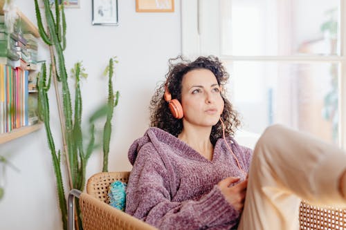 Woman Listening To Music in Living Room