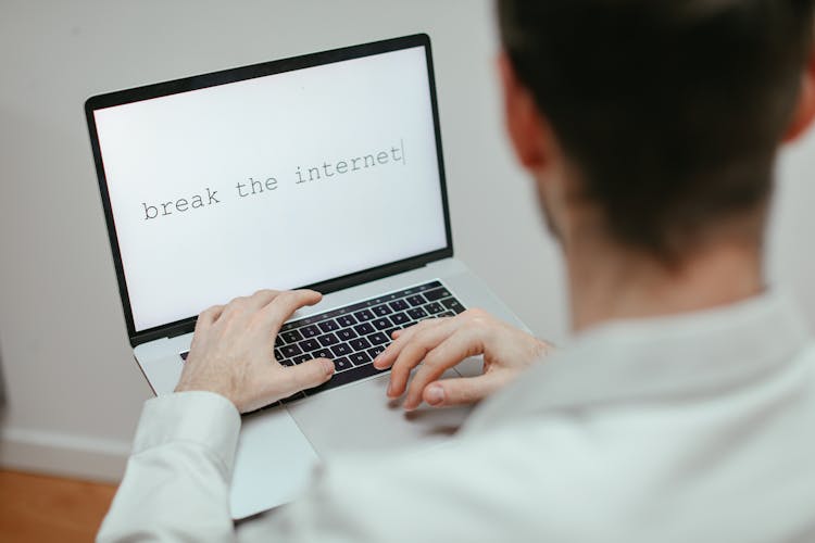 Person Typing On A Laptop