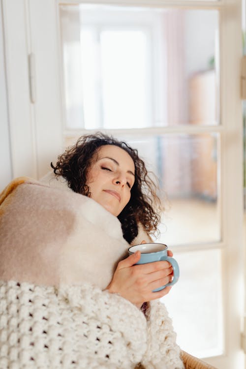 Woman Sleeping under Blanket