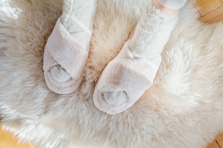 Fluffy Sandals On The Feet Of A Woman