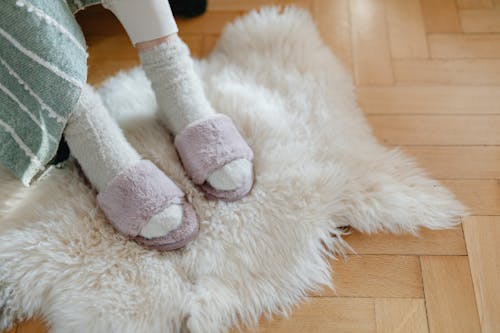 Free White Fur Textile on Brown Wooden Floor Stock Photo