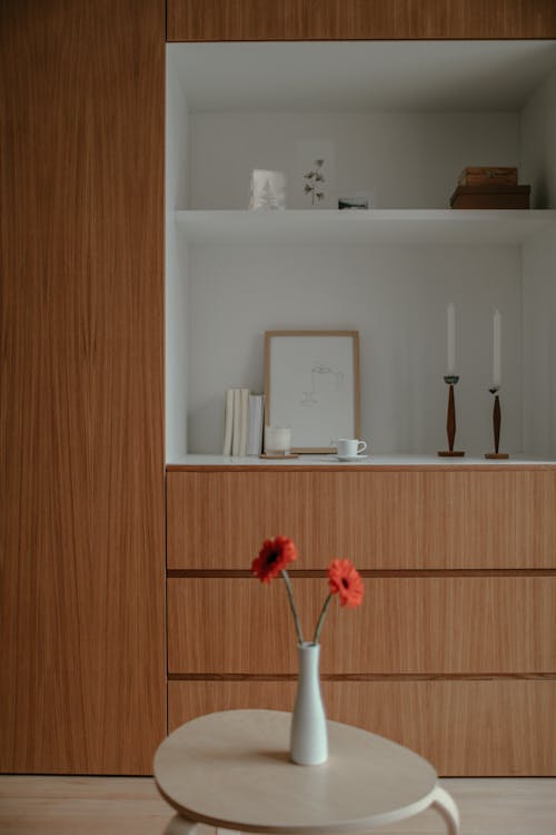 Red Flowers in White Vase on a Table