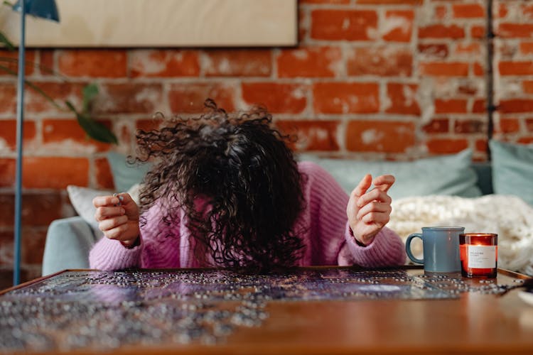 Woman Annoyed At Difficult Puzzles 