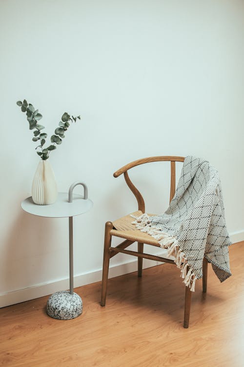 Wooden Chair Beside a Side Table