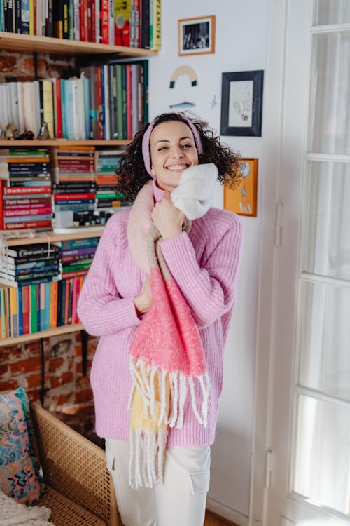Free Happy Woman in Wool Scarf at Home Stock Photo