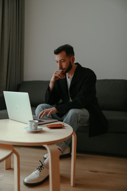 Man with Laptop on Table