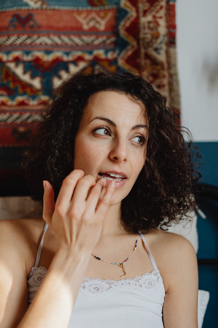 Woman Applying Lip Balm 