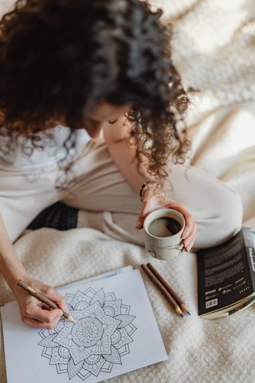 A Woman Coloring an Artwork