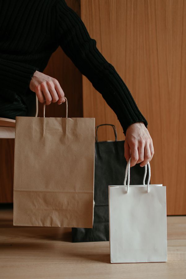 Brown and white paper carry bags