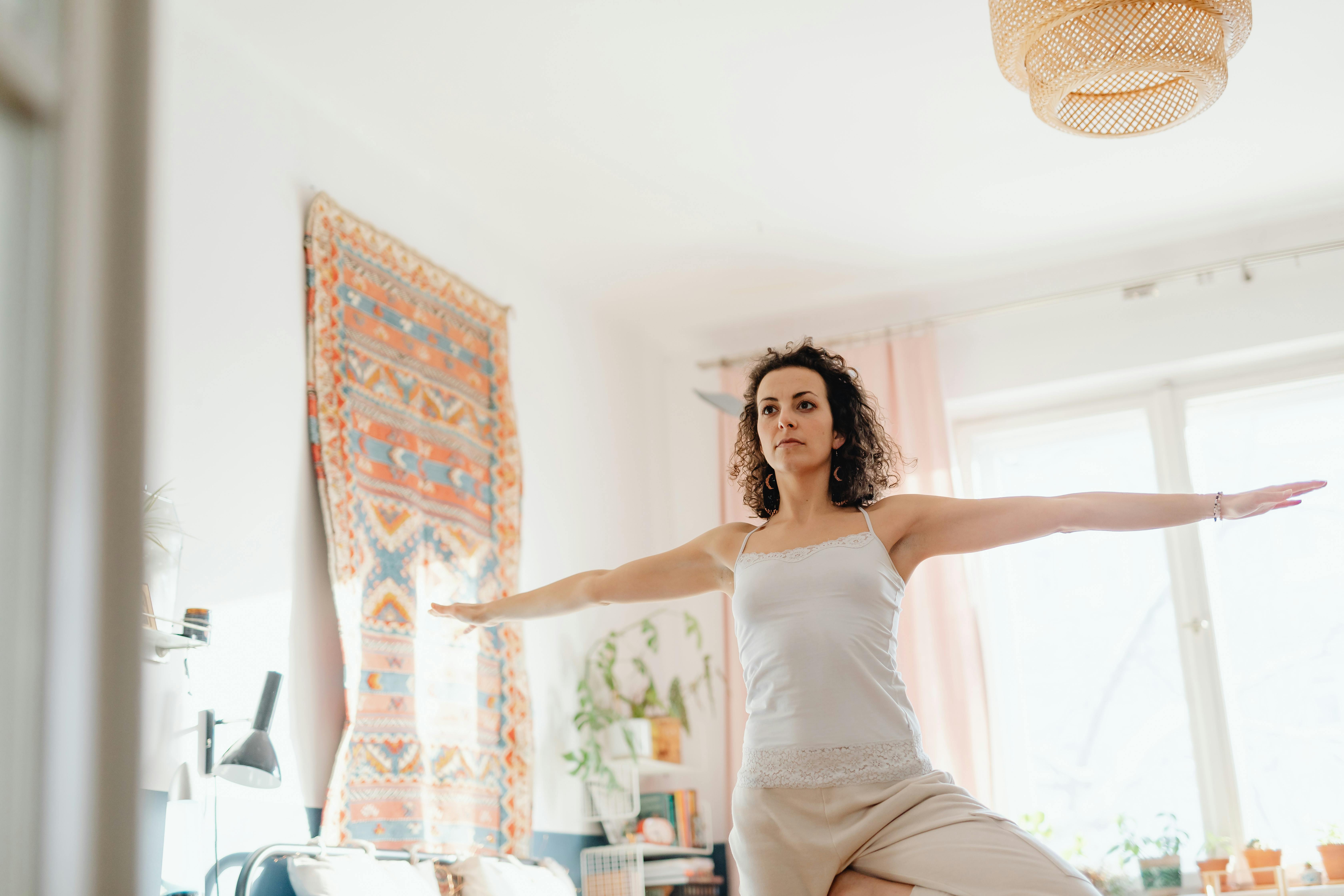 Calm individual practicing mindfulness, possibly in a home setting. Alt: "Person practicing self-administered bilateral stimulation for daily calm." - The Science Behind Bilateral Stimulation and Memory Processing