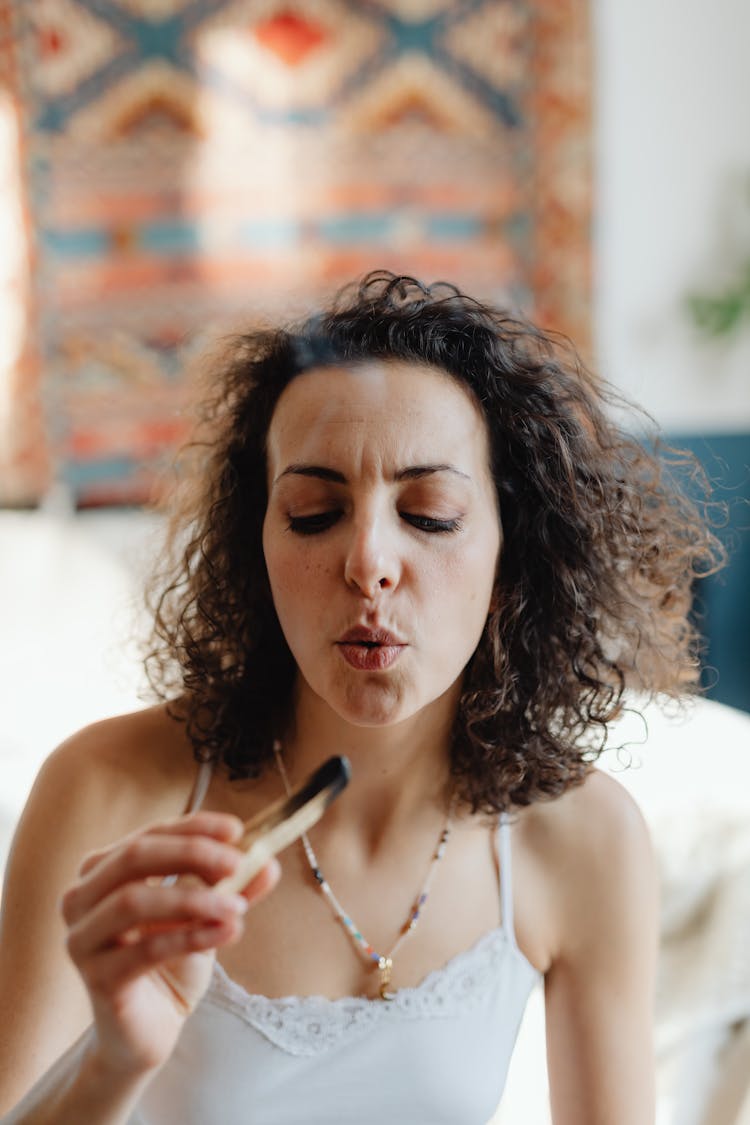 Woman With Palo Santo Wood Stick