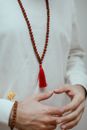 Woman in White Long Sleeve Shirt Wearing Gold Necklace
