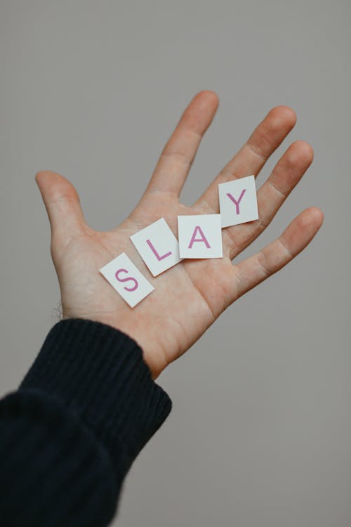 Free Person Hand with Word from Paper Letters in Palm Stock Photo