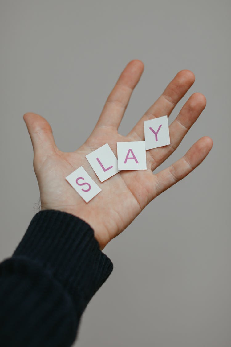 Person Hand With Word From Paper Letters In Palm