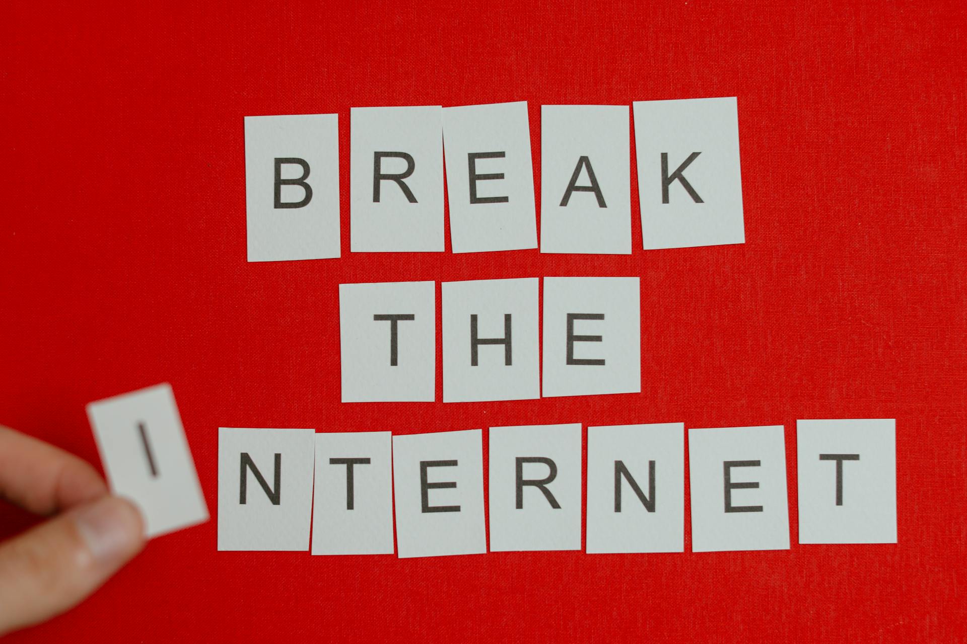 Break the Internet Phrase in Cutout Letters on Red Background