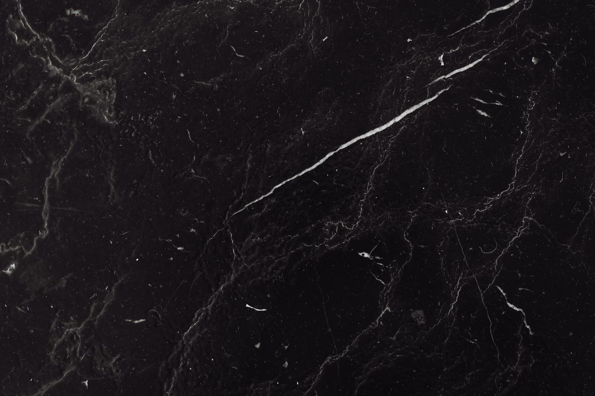 Dark charcoal marble texture with light veining