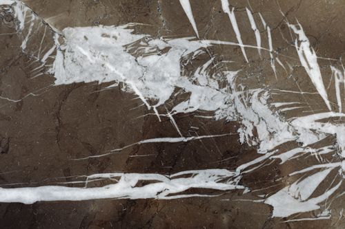 Free Close-up of a marble rock surface showcasing intricate patterns and textures. Stock Photo