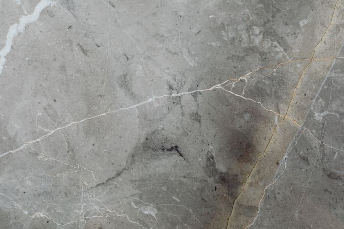 Close-up of sawn grey stone floor tile