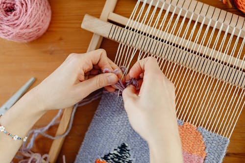 Woman Weaving with Wool Threads