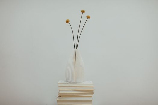 White Book With Brown Flower on Top