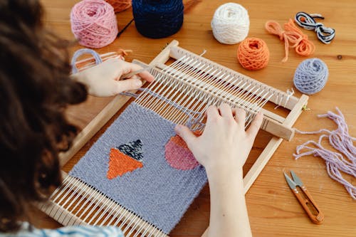 Female Weaver Using a Weaving Loom