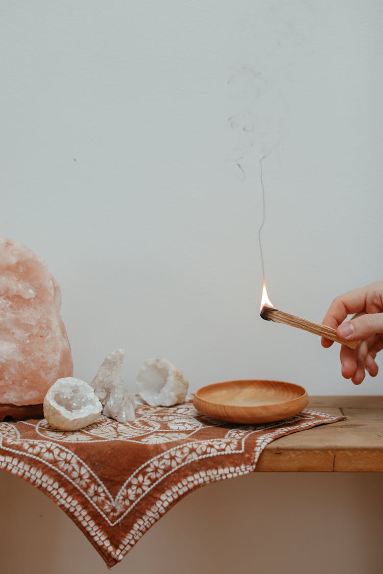 A Person Holding A Burning Palo Santo