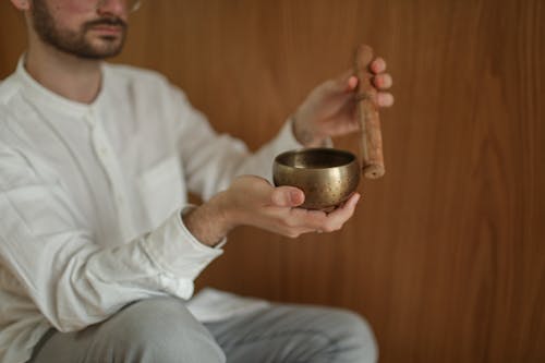 Man Using Tibetan Singing Bowl