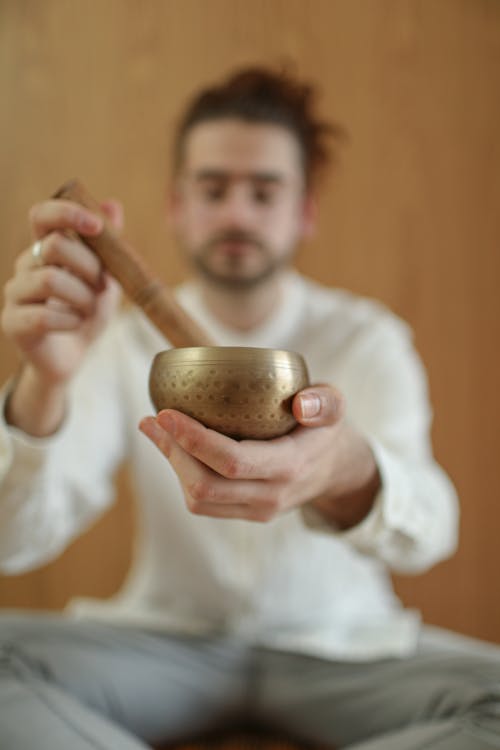 Man Using Tibetan Singing Bowl