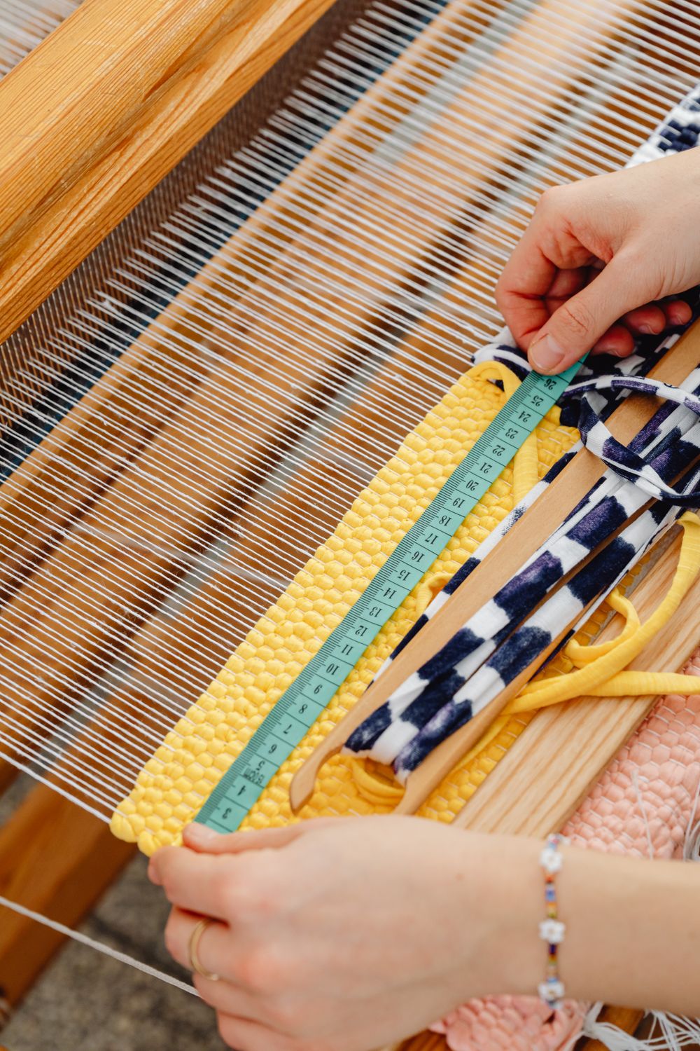 Close-up of Person Weaving with Wool Threads · Free Stock Photo