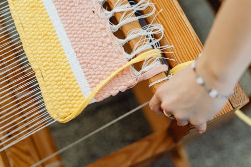 Close-up of Weaving on Machine with Wool Threads