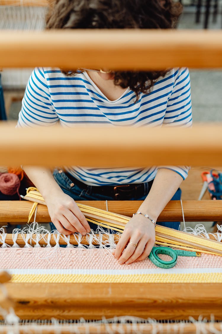 Female Weaver Using A Weaving Loom