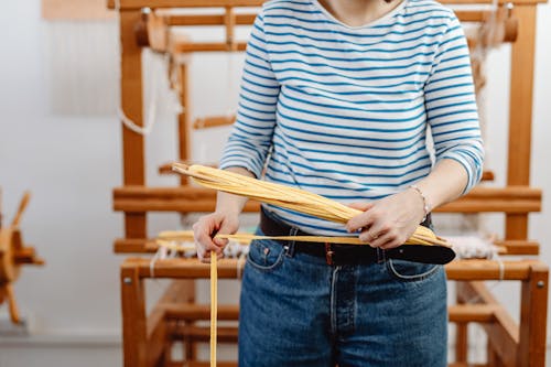 A Person Holding Cotton Thread