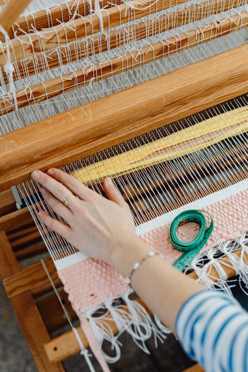A Person Sitting Near the Loom