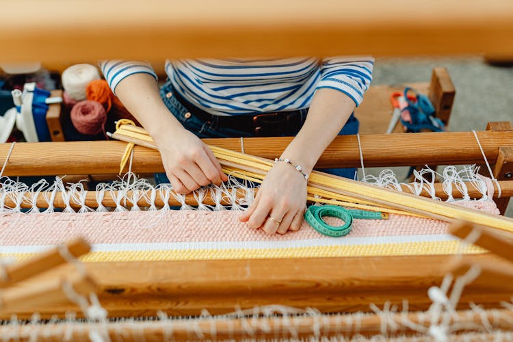 Hands Of Weaver Manufacturing Table Runner On Loom