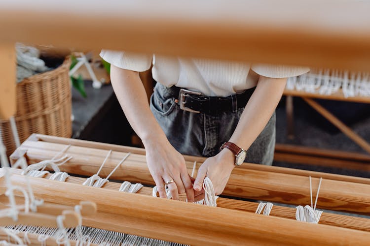 Woman Working On Weaving Fabric