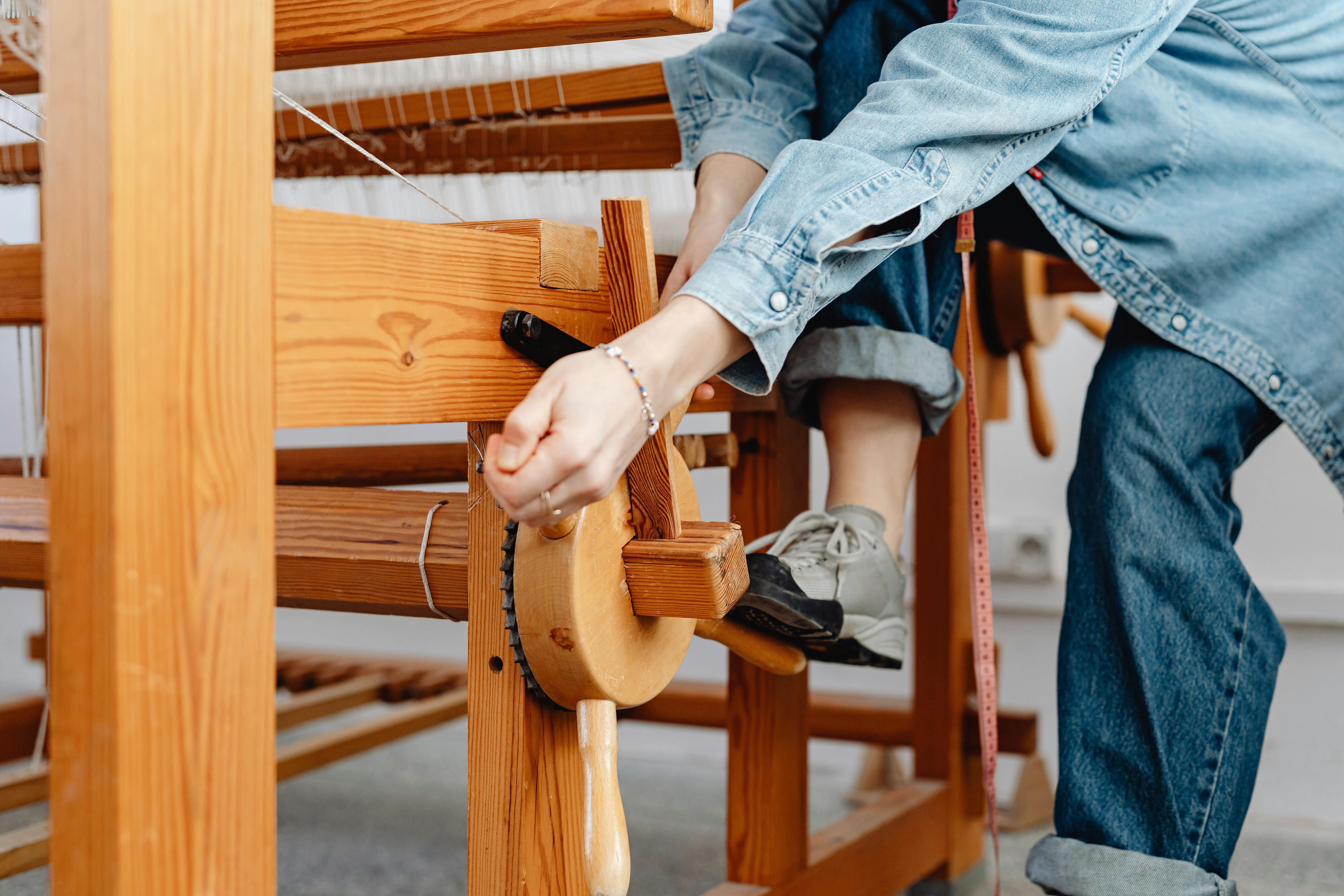 woman weaver setting up loom