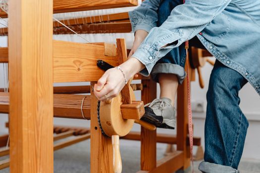 Woman Weaver Setting up Loom
