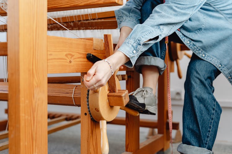 Woman Weaver Setting Up Loom