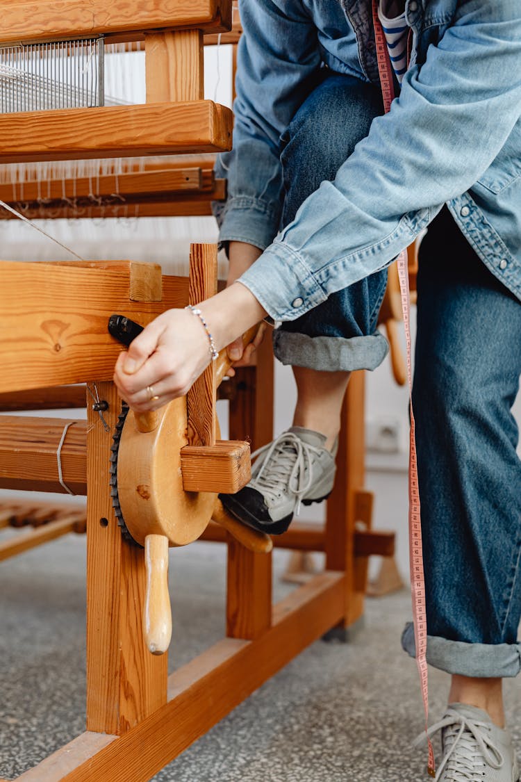 Woman Working Levers Of A Loom