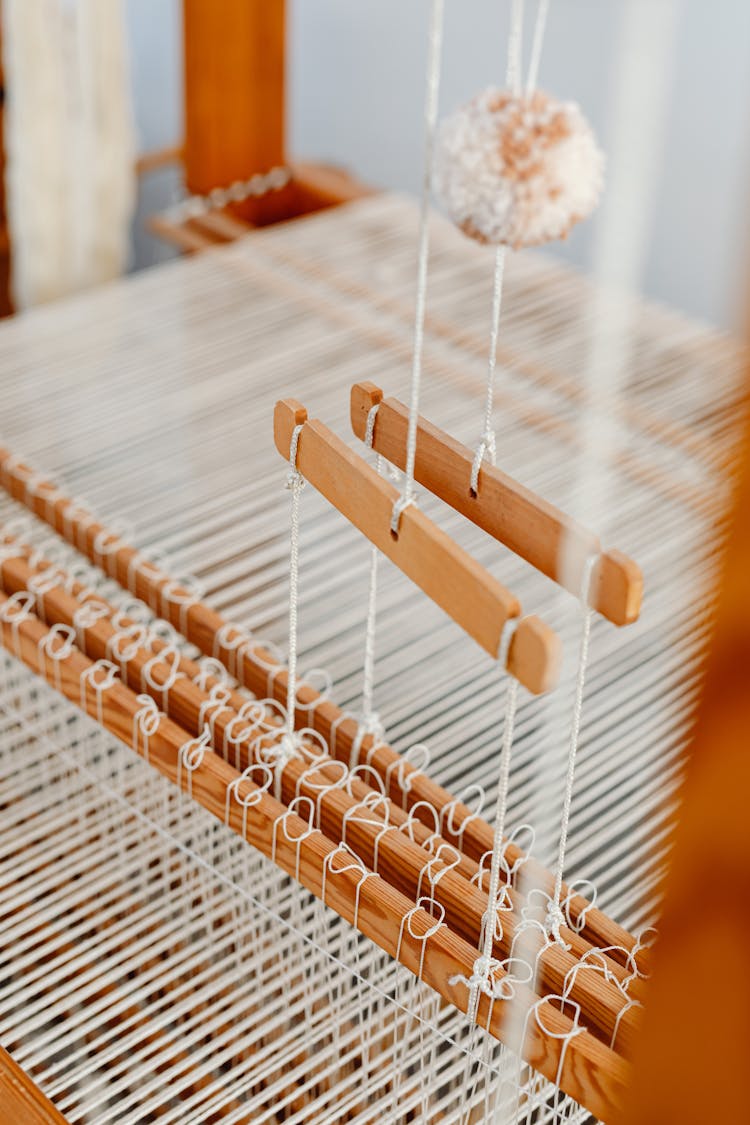 View Of Wooden Home Loom With Weft Warp And Shuttles 