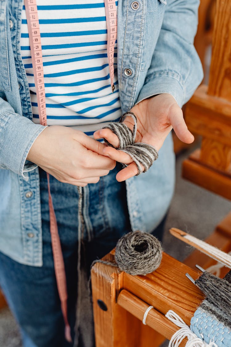 Woman Wrapping A String Around Her Fingers