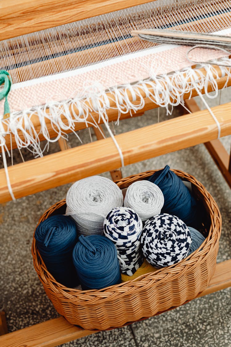 Spindle Of Yarns In A Basket