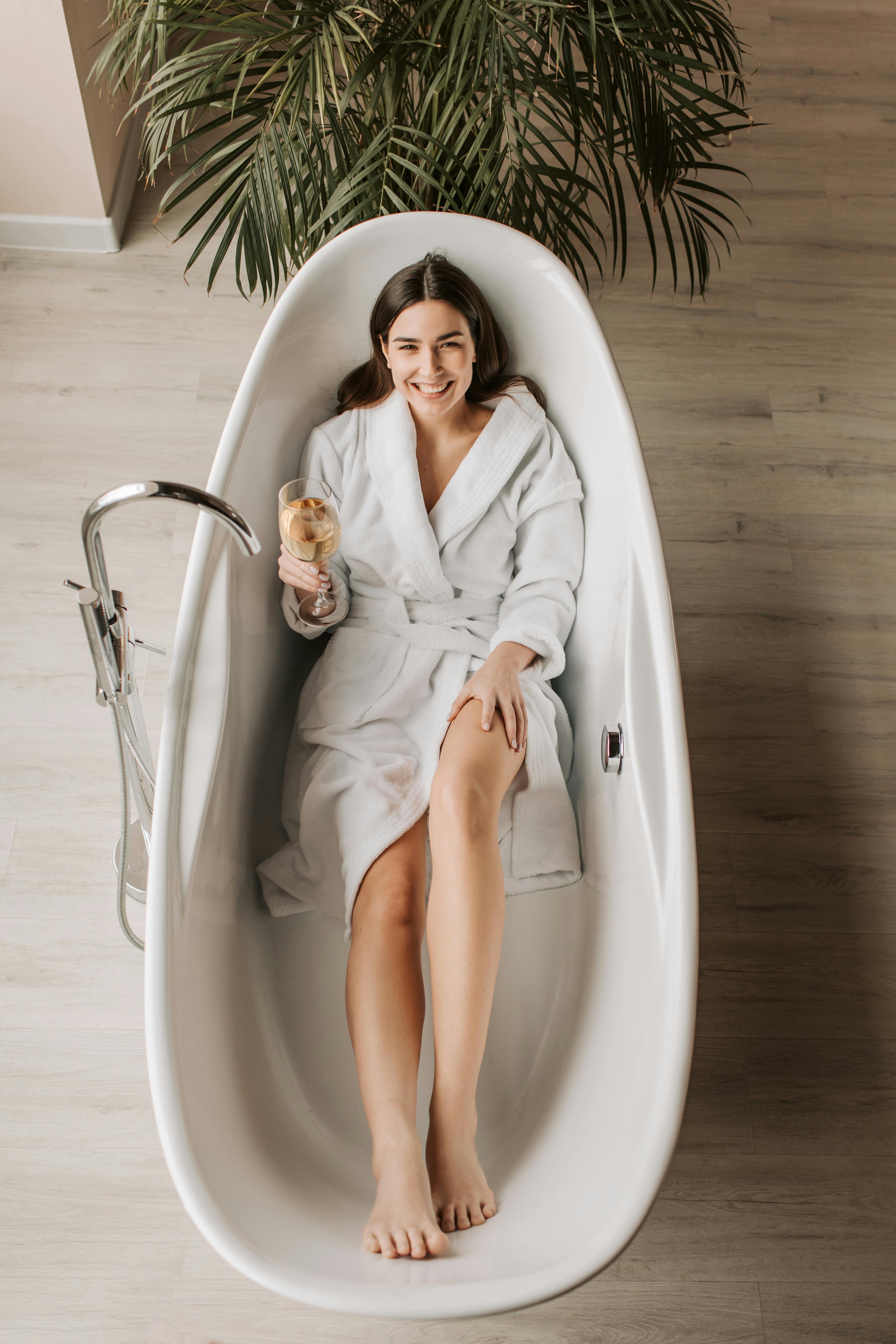 Girl in a White Coat is about To Take a Bath. Girl in a Bathrobe after  Taking a Bath Stock Photo - Image of bathtub, luxury: 168469438
