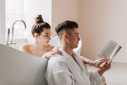 Man and Woman Reading Together