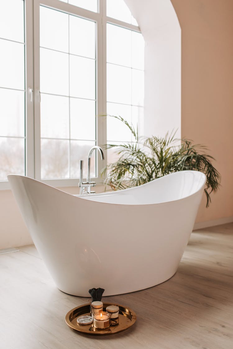 White Bathtub Beside A Window