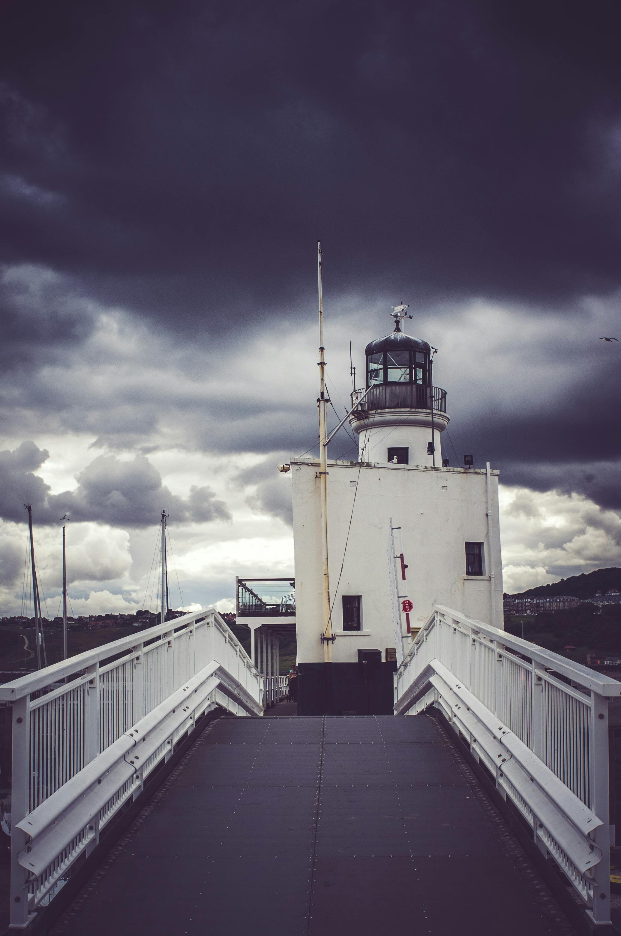 view of cloudy skies on lighthouse