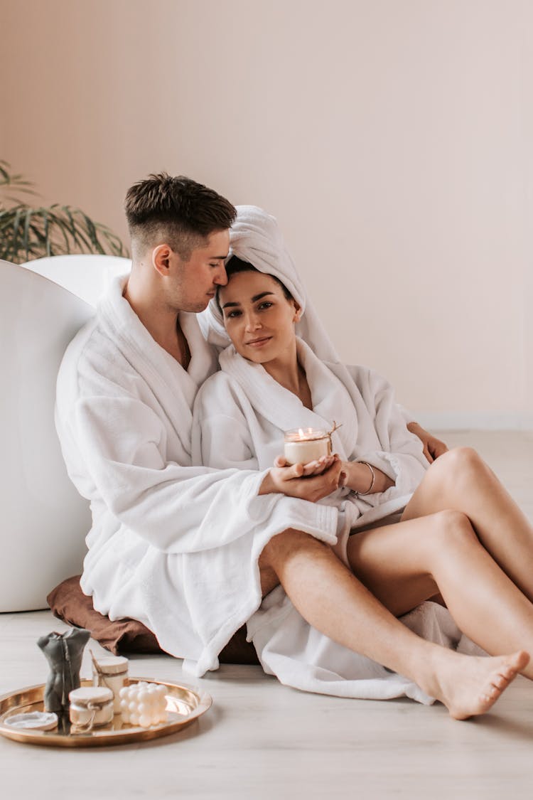 Romantic Couple In White Bathrobes