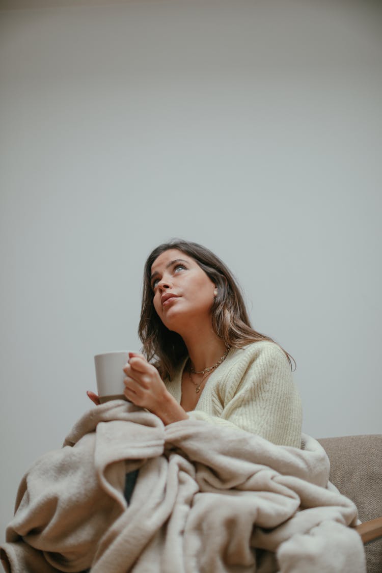 A Woman Holding A Mug