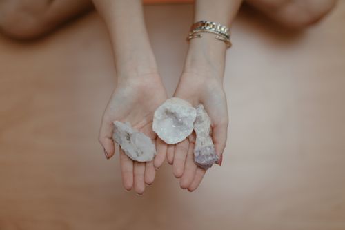 Free A person's hands holding healing crystals, perfect for meditation and mindfulness themes. Stock Photo