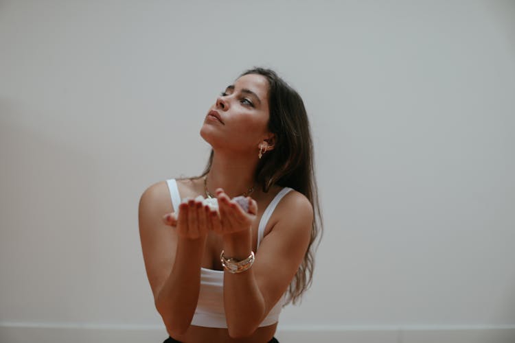 A Woman Holding Gemstones